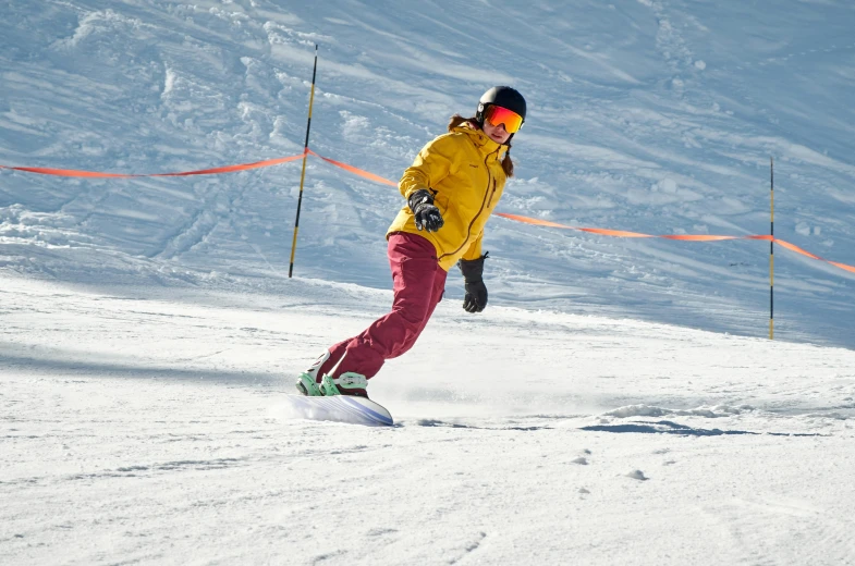 a man riding a snowboard down a snow covered slope, pexels contest winner, avatar image, sports clothing, corduroy, half - turn