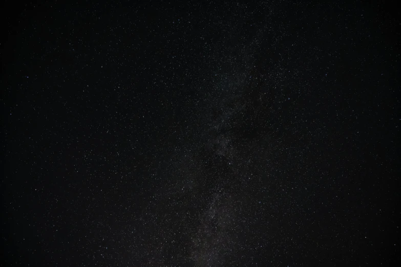 the milky shines brightly in the night sky, by Niko Henrichon, pexels, minimalism, the sky is black, brown, infinite, ash thorp