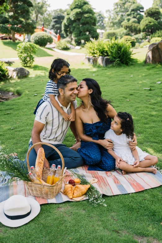 a family having a picnic in the park, pexels contest winner, freida pinto, denim, garden setting, puerto rico