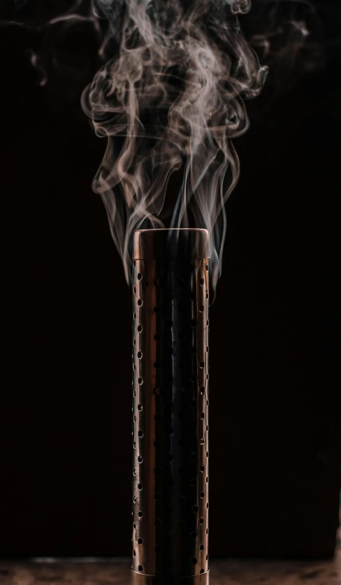 a cigarette with smoke coming out of it, by Joseph Severn, conceptual art, totem pole, shot on sony a 7 iii, demur, rising steam