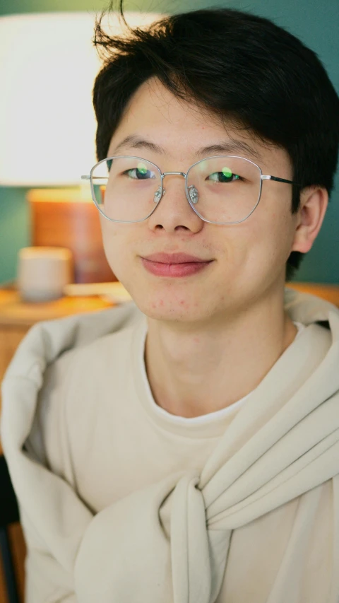 a close up of a person wearing glasses, inspired by Yeong-Hao Han, subject is smiling, medium shot portrait, good lighted photo, nft portrait