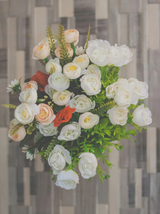 a vase filled with white and red flowers, inspired by Rudolf von Alt, unsplash, orange and white color scheme, high view, pastel roses, designed for cozy aesthetics!