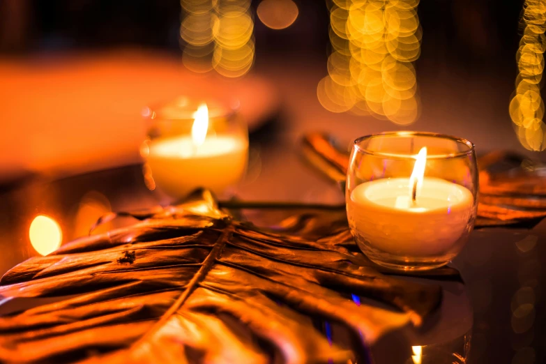 a group of lit candles sitting on top of a table, profile image, fan favorite, bokeh details, paradise garden massage