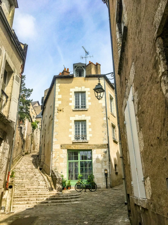 a narrow cobblestone street in an old town, pexels contest winner, paris school, stairs to an upper floor, chartres cathedral, small path up to door, pur champagne damery