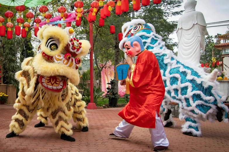 a couple of people that are standing in the street, inspired by Pu Hua, lions, performing, avatar image, vietnam