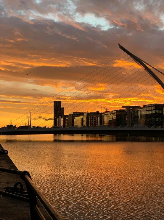 a bridge over a body of water at sunset, happening, ireland, skyline showing, calatrava, thumbnail