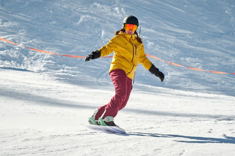 a woman riding a snowboard down a snow covered slope, brightly coloured, tan, customers, thumbnail