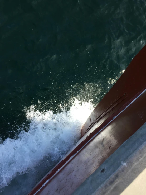 a close up of a boat on a body of water, happening, coming down the stairs, ocean spray, low quality photo, manly