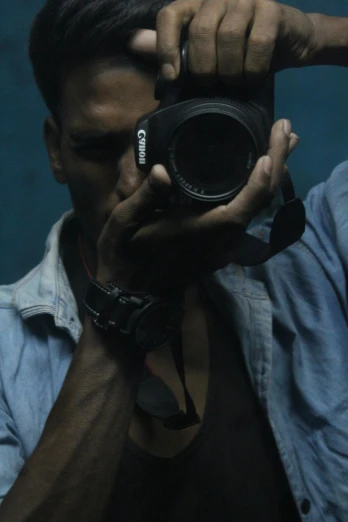 a man taking a picture with a camera, pexels contest winner, art photography, candid!! dark background, body and headshot, looking into a mirror, portrait soft low light