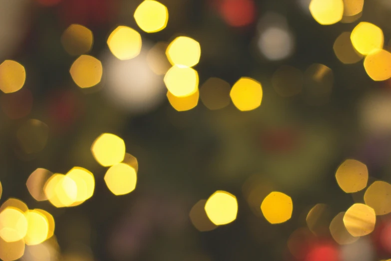 a close up of a christmas tree with lights, by Carey Morris, pexels, light and space, yellow, blurred, instagram post, multiple lights