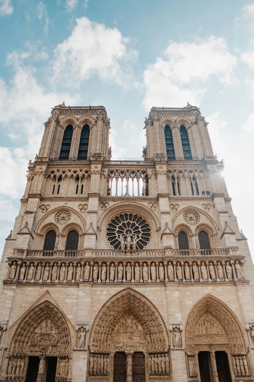 a very tall cathedral with a clock on it's side, pexels contest winner, romanesque, in paris, tiny ornate windows, two hovering twin nuns, leaked photo