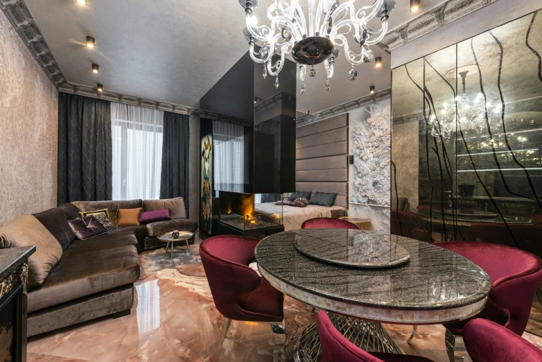 a living room filled with furniture and a chandelier, by Julia Pishtar, neo kyiv, maroon metallic accents, rich marbles, real estate photography