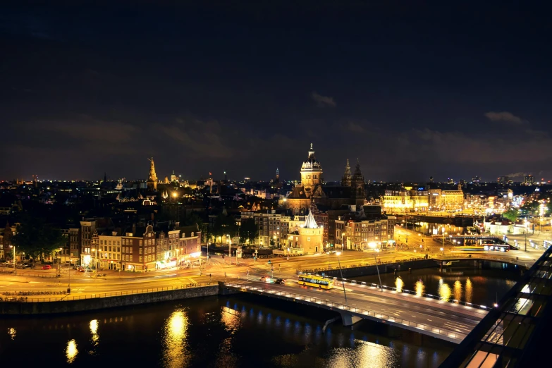 an aerial view of a city at night, by Jan Tengnagel, pexels contest winner, all buildings on bridge, historical photo, dutch, hi resolution