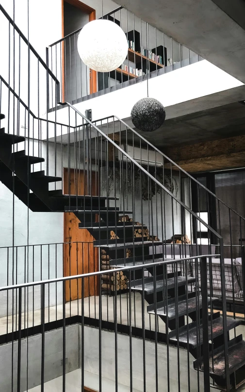 a staircase leading up to a second floor, black steel buildings, las pozas, front facing!!, full room view