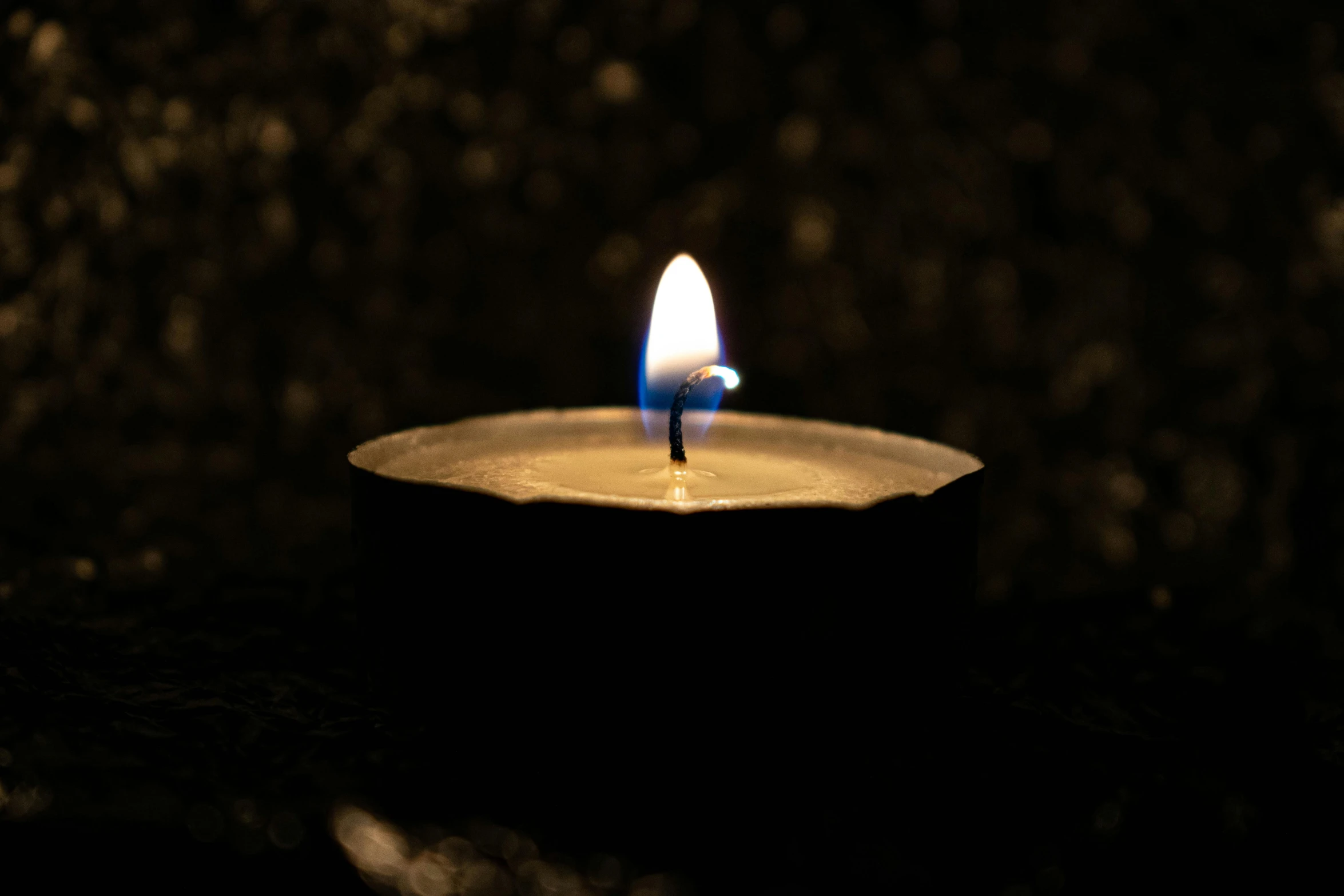 a lit candle sitting on top of a table, profile image, digital image