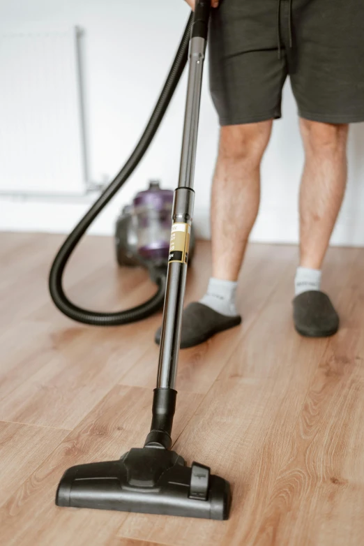 a man with a vacuum on a hard wood floor, pexels contest winner, renaissance, upper and lower body, 15081959 21121991 01012000 4k, servants, lachlan bailey