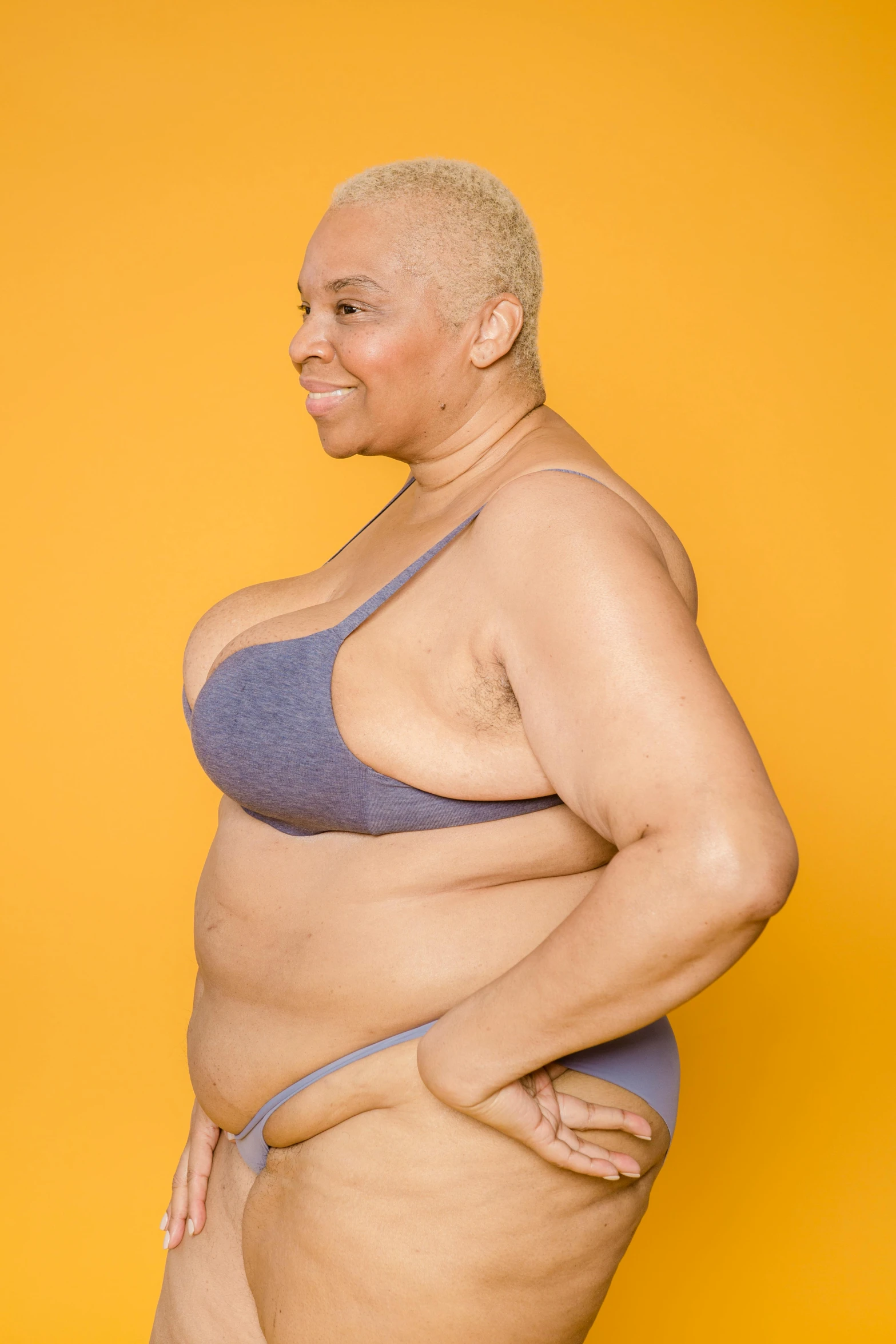 a woman in a bikini posing for a picture, an album cover, inspired by Bert Stern, unsplash, happening, plus size, bald lines, breath taking, big complex belly mechanism