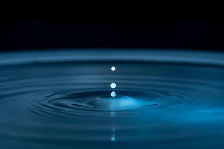 a drop of water falling into a pool of water, unsplash, holography, multiple stories, laura watson, high-quality render, ripple