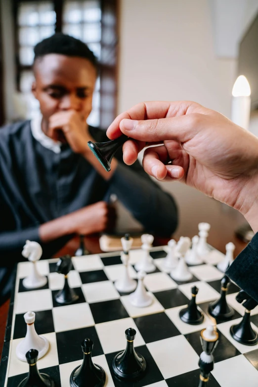 two men playing chess in a living room, pexels contest winner, american barbizon school, black main color, kids playing, thumbnail, getting ready to fight