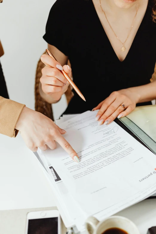 a couple of people that are sitting at a table, on white paper, selling insurance, subtle detailing, signature on the bottom