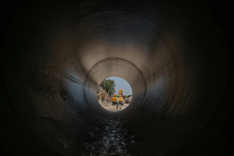 a couple of people that are inside of a pipe, unsplash contest winner, india, infrastructure, lpoty, sewers
