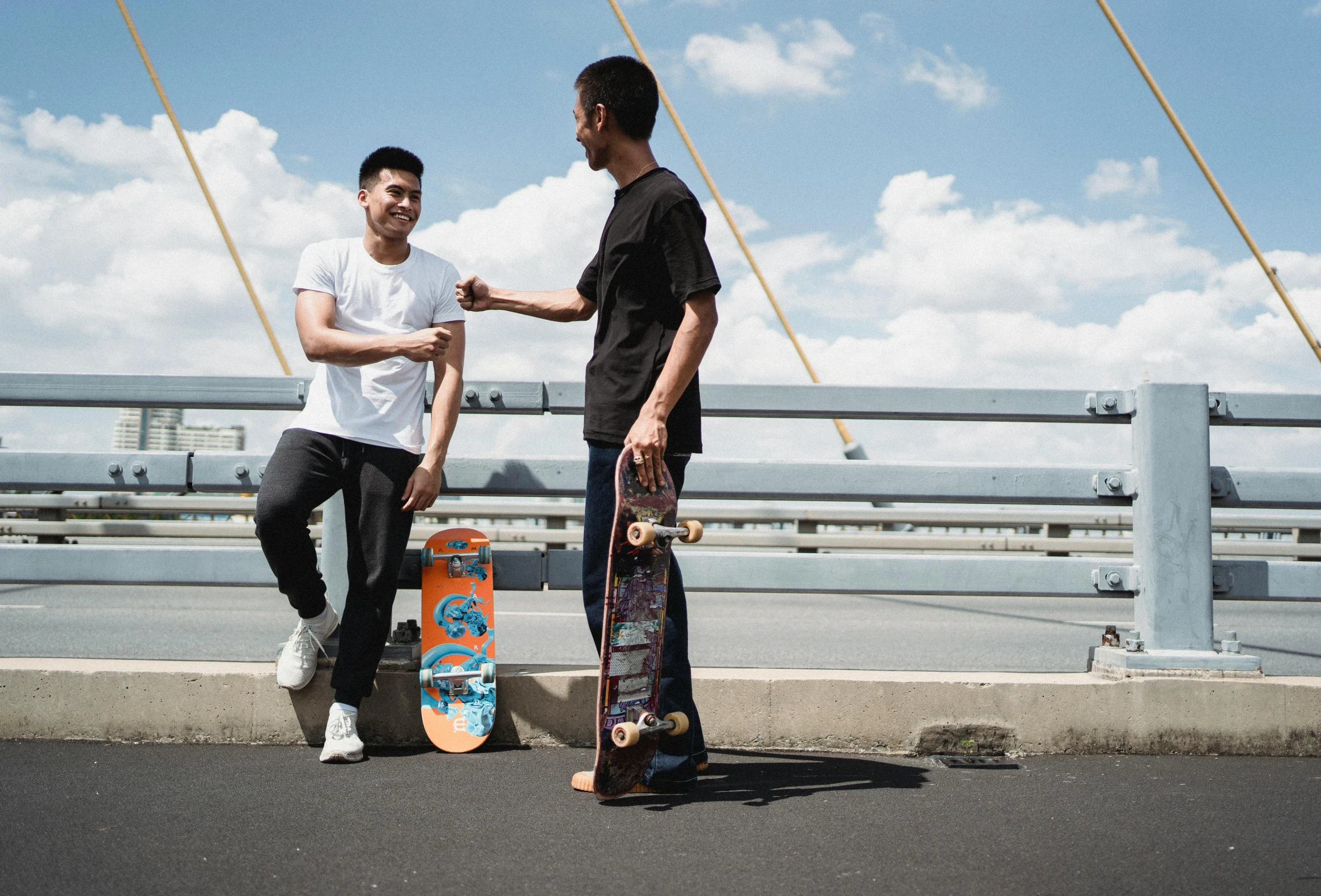 a couple of men standing next to each other on a bridge, pexels contest winner, skateboard art, federation clothing, asian man, thumbnail