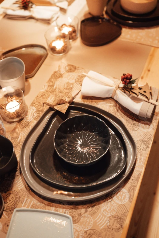 a close up of a table with plates and utensils, by Else Alfelt, ritual, black, warm glow, spa