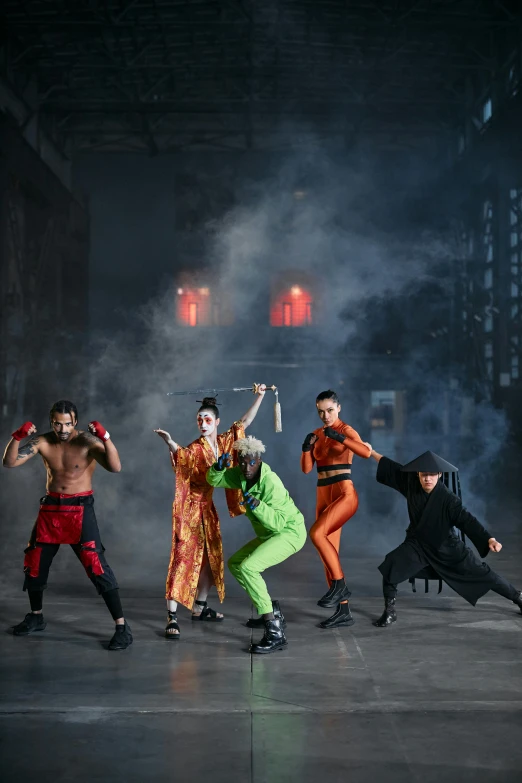 a group of people standing on top of a stage, inspired by Miao Fu, trending on pexels, gutai group, ninja outfit, street fighting, haunted house themed, ( ( theatrical ) )