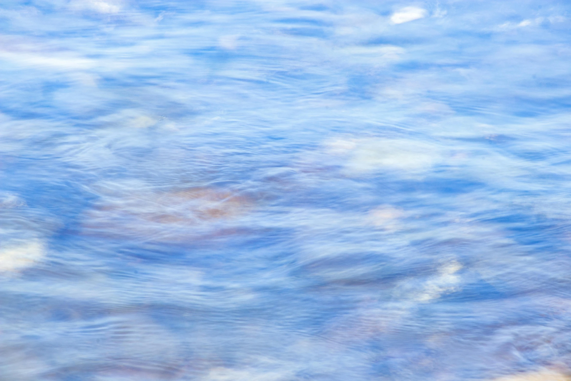 a blurry photo of a body of water, by Jan Rustem, lyrical abstraction, light-blue, ripples, colour photograph, soft light - n 9