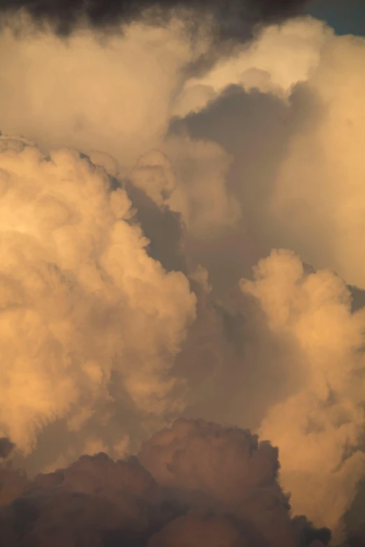 a jetliner flying through a cloudy sky, a picture, inspired by Kim Keever, romanticism, light orange mist, face made out of clouds, dramatic lighting - n 9, up-close