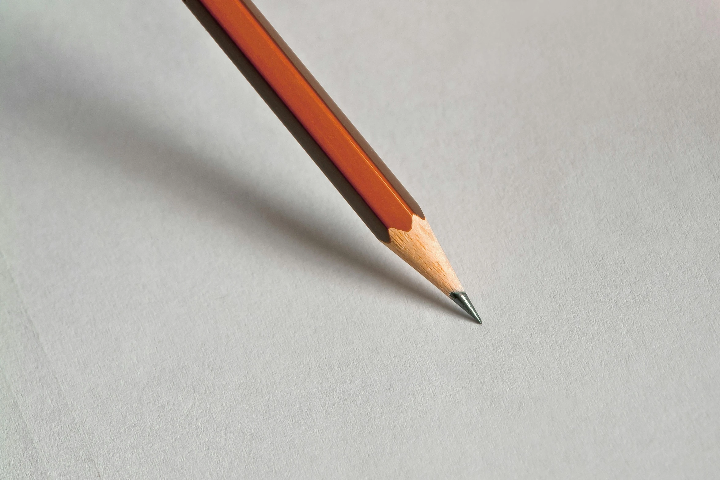 a pencil sitting on top of a piece of paper, grey orange, detailed product image, strathmore 2 0 0, brown