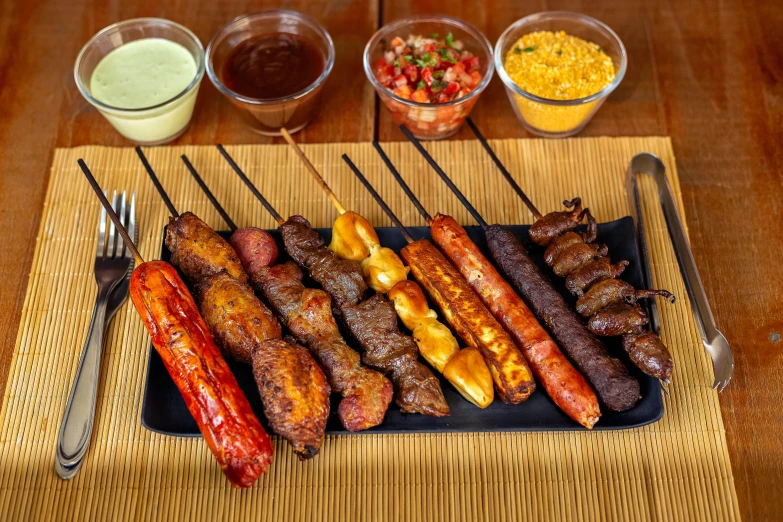 a close up of a plate of food on a table, barbecue, são paulo, profile image, skewer