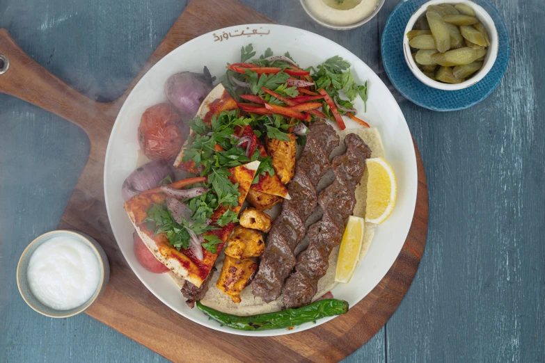 a close up of a plate of food on a table, dau-al-set, profile image, full product shot, kyza saleem, kebab