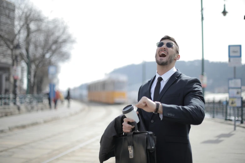 a man in a suit and sunglasses holding a briefcase, pexels contest winner, happening, yawning, ride on time, avatar image, wearing a watch