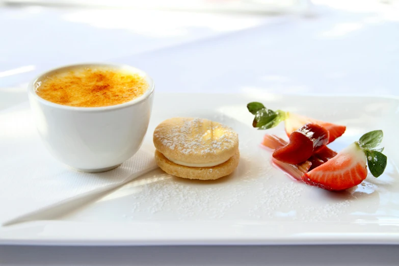 a white plate topped with a dessert next to a cup of coffee, inspired by Charles Le Roux, romanticism, shiny crisp finish, flan, al fresco, breakfast buffet