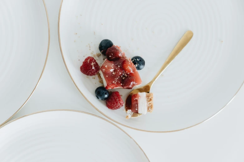 a close up of a plate of food on a table, by Emma Andijewska, unsplash, minimalism, squashed berries, cake, white, background image