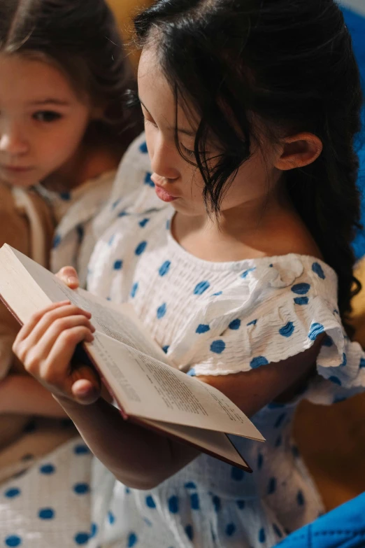 two little girls are reading a book together, a portrait, by Adam Marczyński, pexels, incoherents, wearing a nightgown, 15081959 21121991 01012000 4k, pictured from the shoulders up, thumbnail