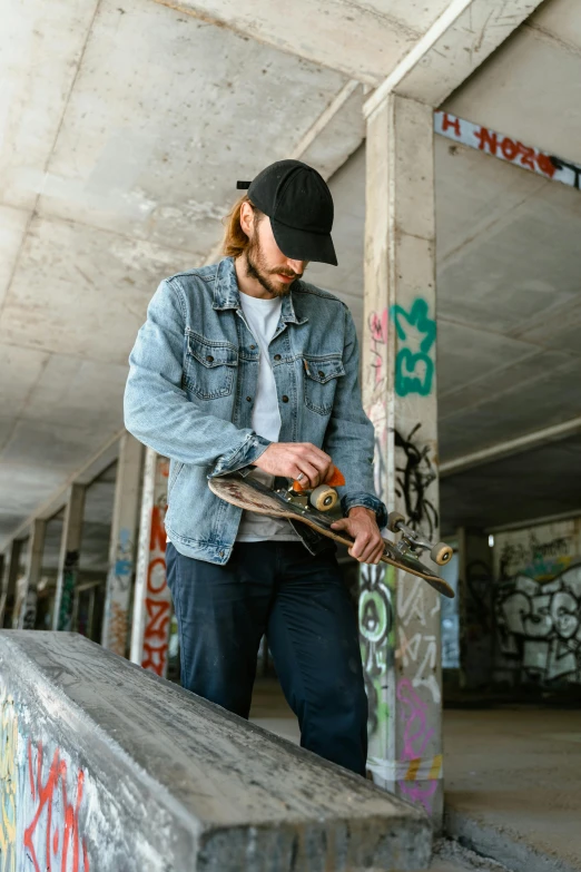 a man riding a skateboard up the side of a ramp, pexels contest winner, graffiti, wears a destroyed hat, holding wood saw, colin greenwood (bass), inspect in inventory image