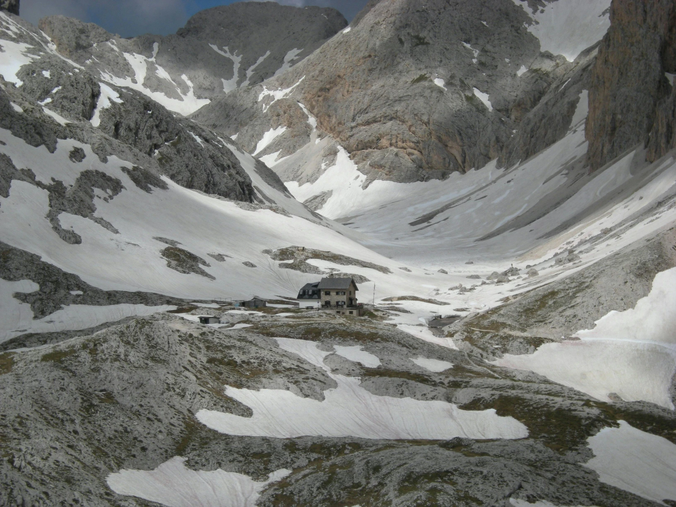 a group of people standing on top of a snow covered mountain, hut, inlets, valle dei templi, best photo