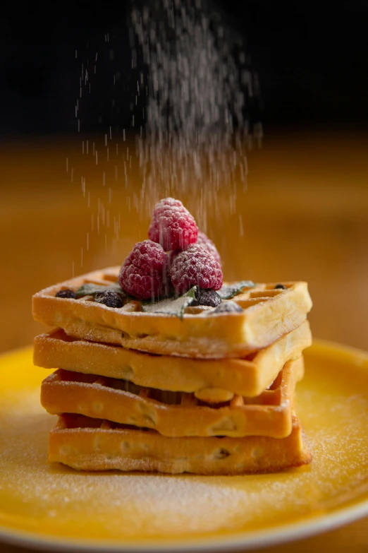 a stack of waffles sitting on top of a yellow plate, by Matthias Stom, unsplash, photorealism, powdered sugar, pouring, square, mint