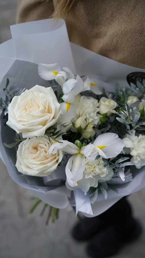 a person holding a bouquet of white flowers, silver mist, no cropping, slate, brilliant detail