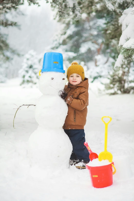 a little boy standing next to a snowman, a picture, pexels contest winner, square, espoo, screensaver, gold