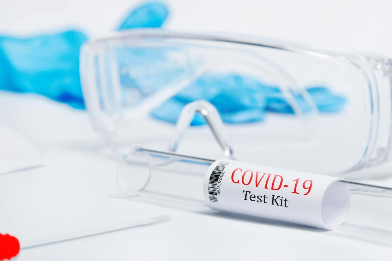 a pair of goggles sitting next to a test tube, a picture, by Matt Cavotta, shutterstock, poster of corona virus, first aid kit, set against a white background, avatar image