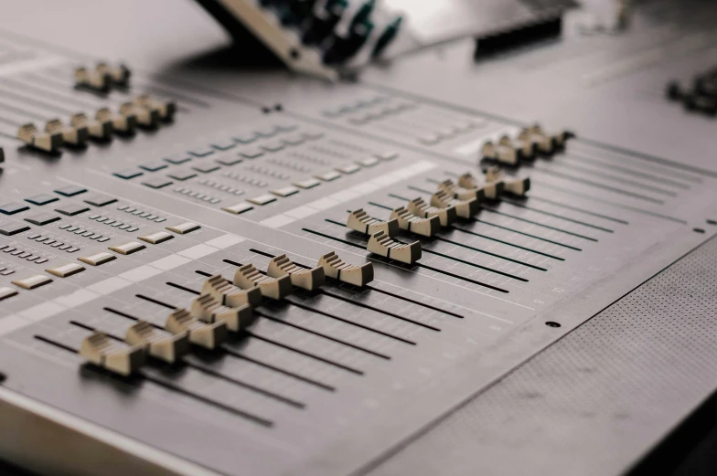 a close up of a control board in a recording studio, an album cover, unsplash, computer art, on a gray background, machines, calarts, offset lithography