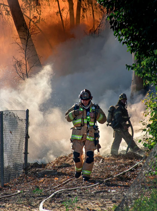 a group of firefighters standing in front of a fire, by Dan Luvisi, happening, smoke and debris, promo image, walking down, neighborhood