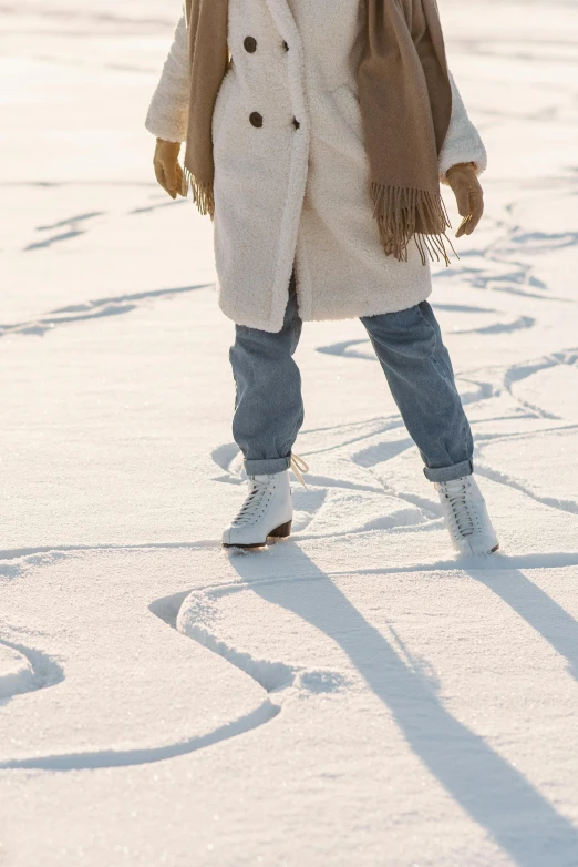 a little girl that is standing in the snow, trending on pexels, graffiti, walking on the sand, soft surface texture, wearing off - white style, woman