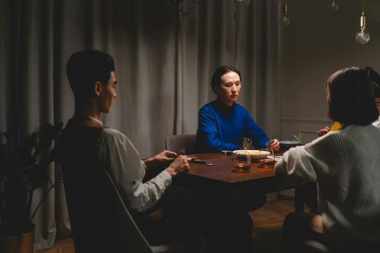 a group of people sitting around a wooden table, by Adam Marczyński, pexels contest winner, hyperrealism, medium shot of two characters, evening mood, hammershøi, affable ， wenjun lin