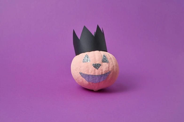 a paper pumpkin with a crown on top of it, textured base ; product photos, sinister pose, thumbnail, prince