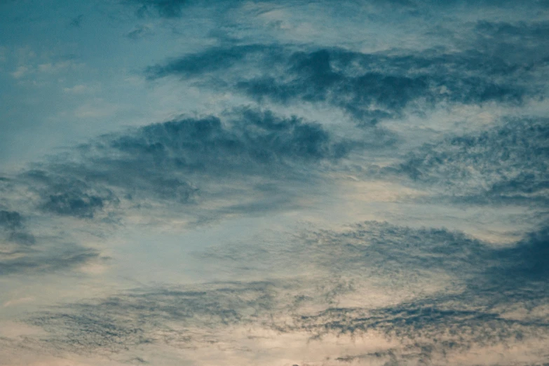 there is a plane that is flying in the sky, inspired by Elsa Bleda, pexels contest winner, romanticism, layered stratocumulus clouds, today\'s featured photograph 4k, early evening, sky blue