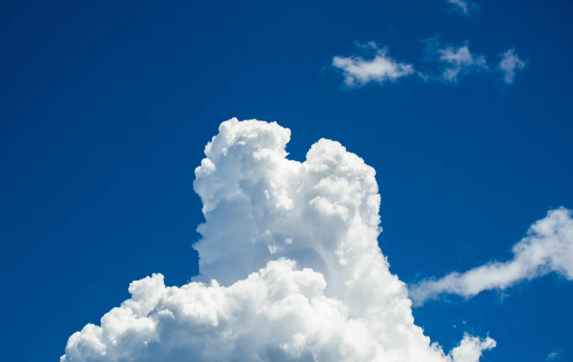 a large cloud in the middle of a blue sky, by Jan Rustem, unsplash, profile image, high detail photo, towering, shot on sony a 7 iii